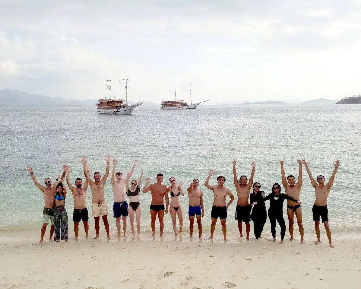 Guests on a beach inside Komodo National Park
