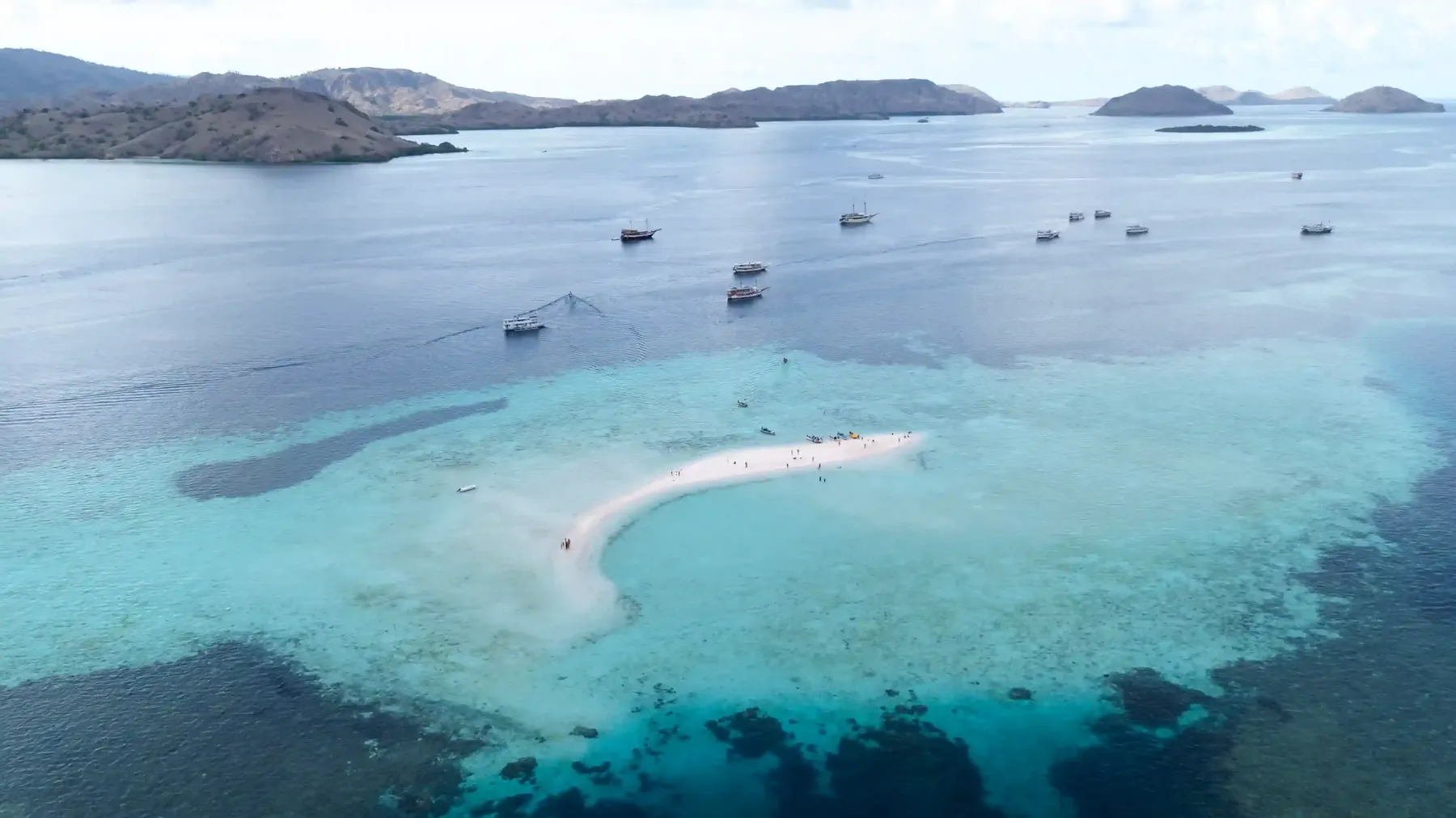 The crescent sandbar of Taka Makassar in Komodo National Park